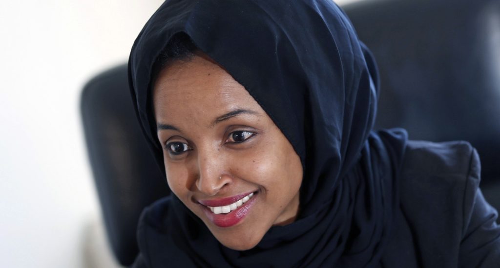 In this Thursday, Jan. 5, 2017 photo, new State Rep. Ilhan Omar is interviewed in her office two days after the 2017 Legislature convened in St. Paul, Minn. Omar is the first Somali-American to be elected to a state legislature in the U.S. The 33-year-old wife, mother, refugee and immigrant reflected on her many roles and how she'll try to voice and inspiration for denigrated minority communities like her own. (AP Photo/Jim Mone)
