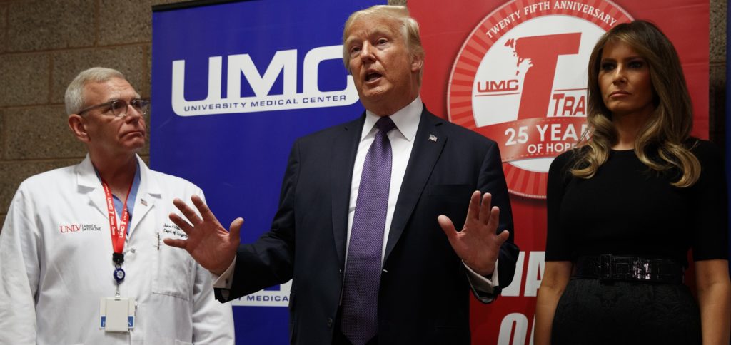 President Donald Trump talks with reporters after meeting with victims of the mass shooting at University Medical Center , Wednesday, Oct. 4, 2017, in Las Vegas. (AP Photo/Evan Vucci)