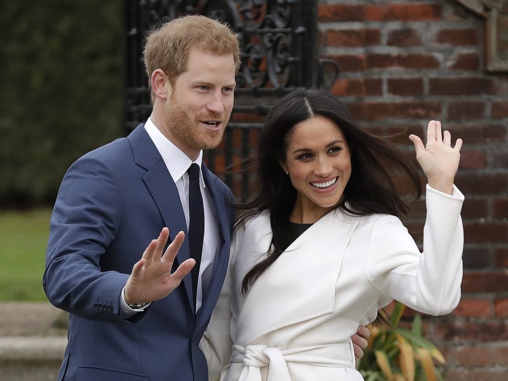Britain's Prince Harry and his fiancee Meghan Markle pose for photographers during a photocall in the grounds of Kensington Palace in London, Monday Nov. 27, 2017. Britain's royal palace says Prince Harry and actress Meghan Markle are engaged and will marry in the spring of 2018. (AP Photo/Matt Dunham)