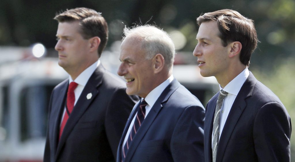 FILE - In this Aug. 4, 2017 file photo, from left, White House Staff Secretary Rob Porter, White House Chief of Staff John Kelly, and White House senior adviser Jared Kushner walk to Marine One on the South Lawn of the White House in Washington. President Donald Trump was en route to Bedminster, N.J., for vacation. White House staff secretary Porter has resigned following allegations of domestic abuse by his two ex-wives. (AP Photo/Alex Brandon)