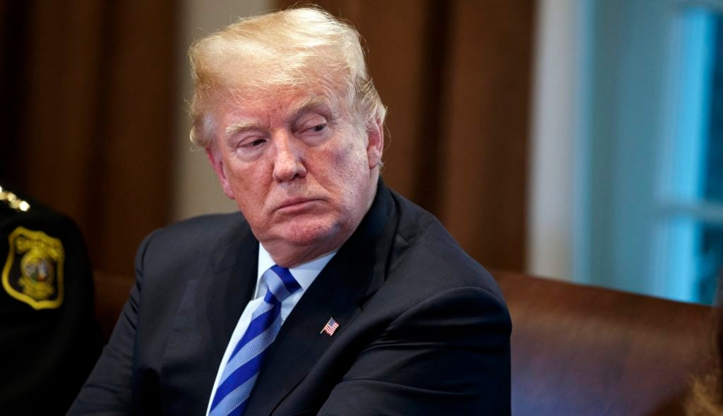 President Donald Trump listens during a roundtable on immigration policy in California, in the Cabinet Room of the White House, Wednesday, May 16, 2018, in Washington. (AP Photo/Evan Vucci)