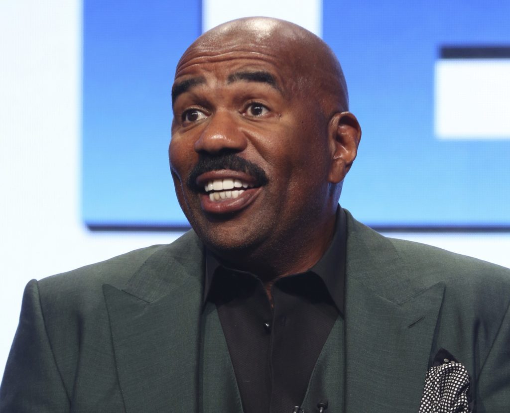 FILE - In this Aug. 3, 2017 file photo, host/executive producer Steve Harvey participates in the "Steve" panel during the NBC Television Critics Association Summer Press Tour in Beverly Hills, Calif. Harvey will be stationed in Times Square for "Fox's New Year's Eve with Steve Harvey." It will air Sunday, Dec. 31, from 8 to 10 p.m. and from 11 p.m. to 12:30 a.m. (Photo by Willy Sanjuan/Invision/AP, File)
