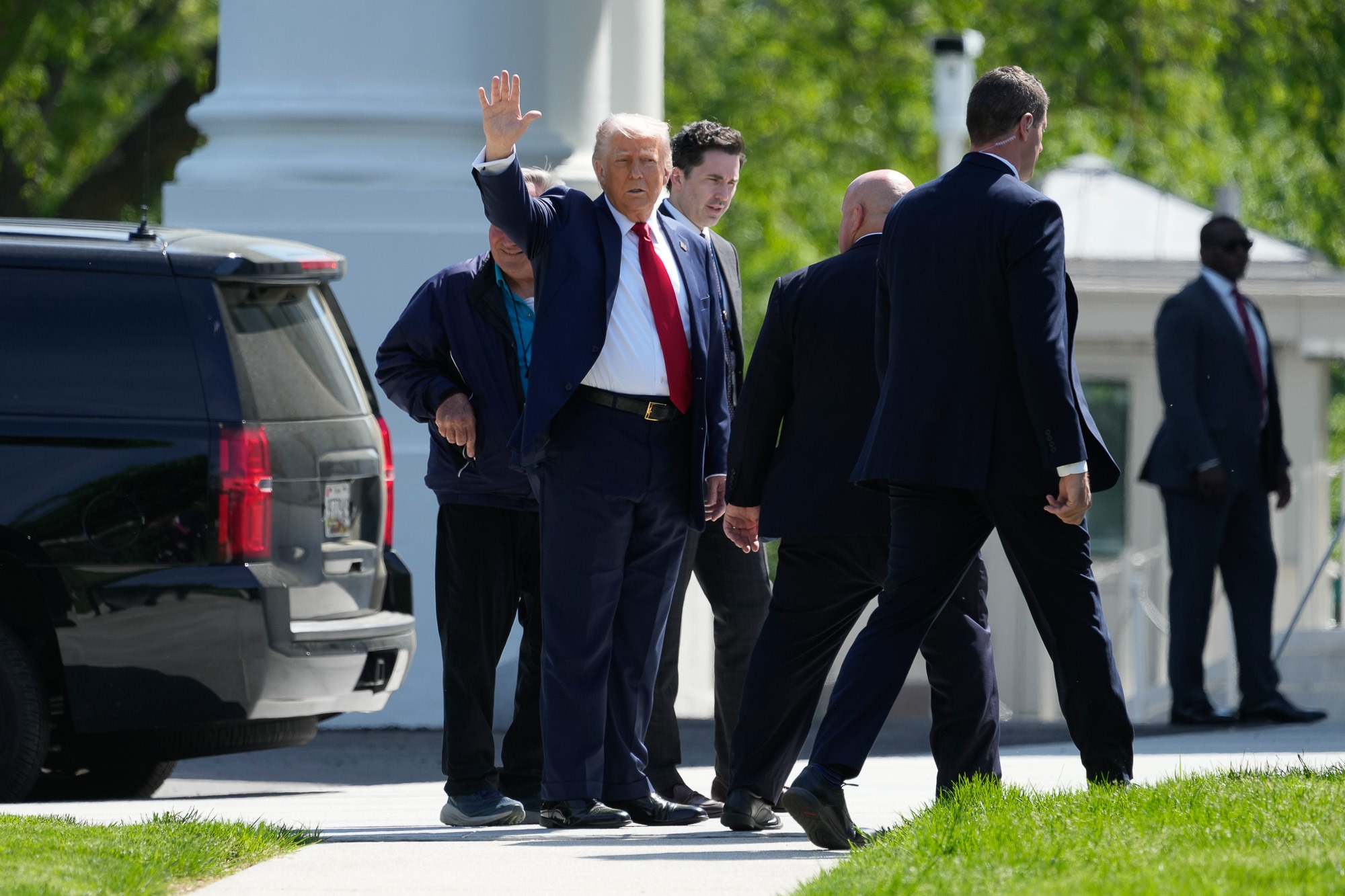President Trump outside the White House amid legal dispute with 60 Minutes and The New York Times