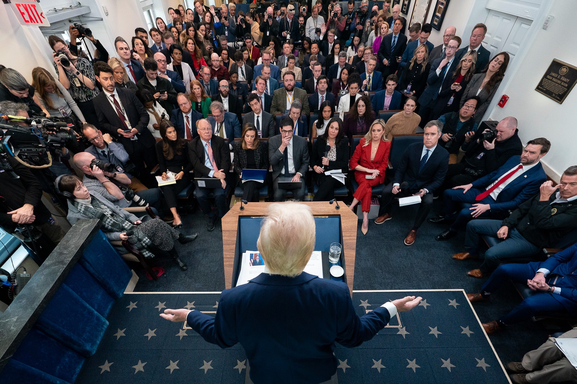 Donald Trump addresses a packed room of reporters at the White House amid growing economic turmoil during his second term