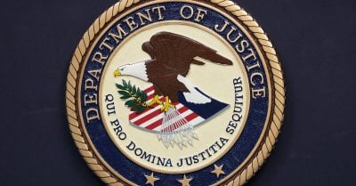 Department of Justice seal displayed on a wall as the agency’s Civil Rights Division faces mass resignations under Trump’s second term