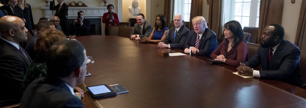 President Donald Trump and Vice President Mike Pence meets with members of the Congressional Black Caucus in the Cabinet Room of the White House in Washington, Wednesday, March 22, 2017. White House Director of communications for the Office of Public Liaison Omarosa Manigault is fifth from right. (AP Photo/Andrew Harnik)