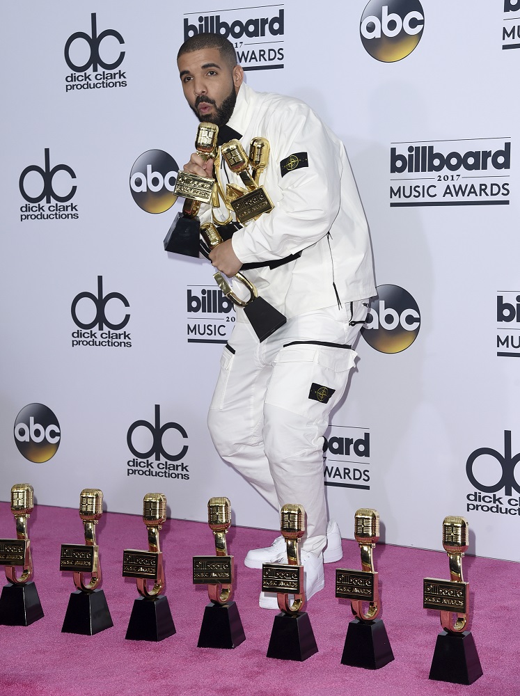 Drake poses in the press room with his 13 awards at the Billboard Music Awards at the T-Mobile Arena on Sunday, May 21, 2017, in Las Vegas. Drake won for Top Artist, Top Male Artist, Top Billboard 200 Album for "Views", Top Billboard 200 Artist, Top Hot 100 Artist, Top Song Sales Artist, Top Steaming Songs Artist, Top Rap Artist, Top Rap Tour, Top Rap Album for "Views", Top Streaming Song (Audio) for "One Dance", Top R&B Song for "One Dance", and Top R&B Collaboration for "One Dance".(Photo by Richard Shotwell/Invision/AP)