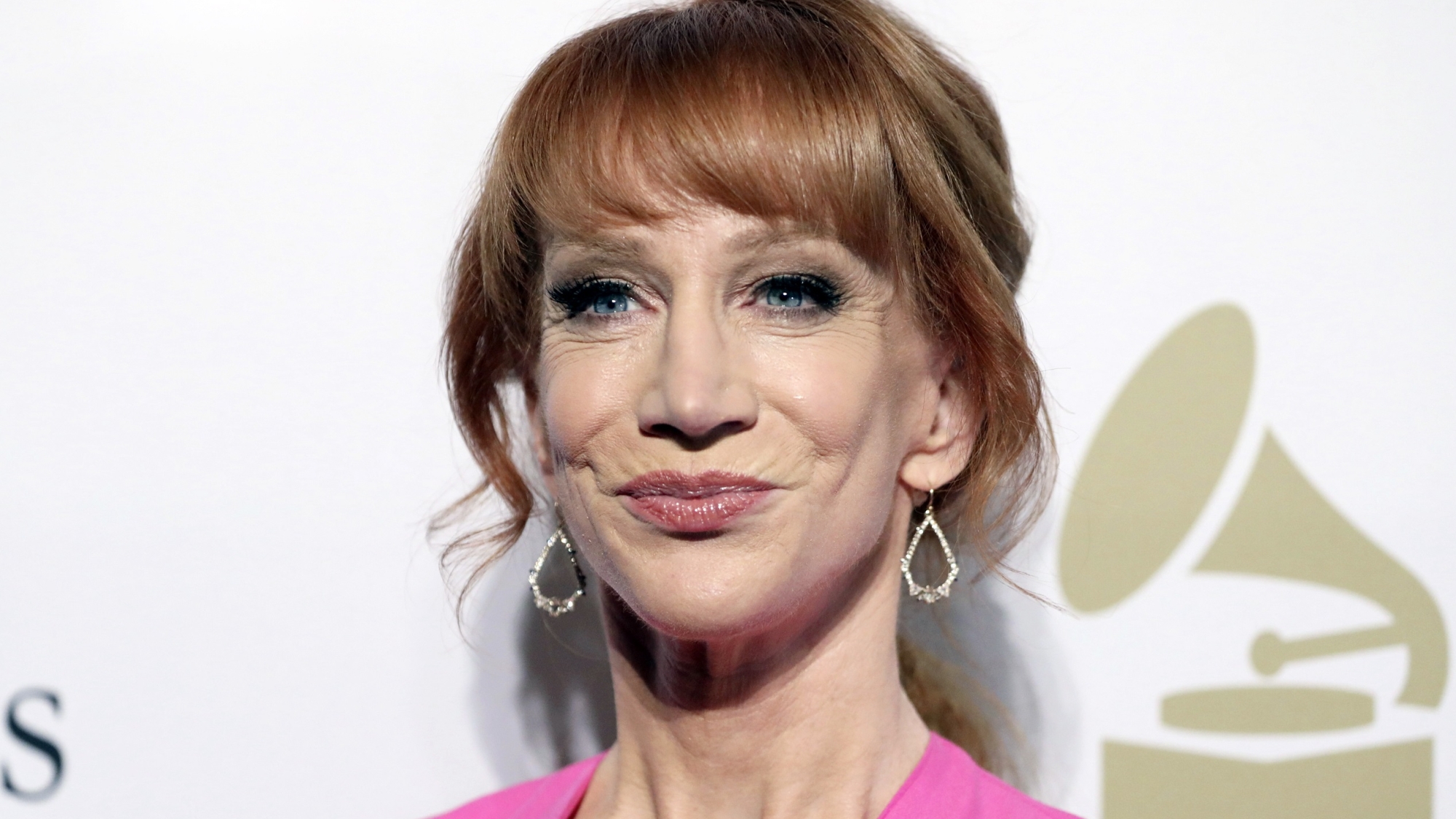 FILE - In this Feb. 11, 2017 file photo, comedian Kathy Griffin attends the Clive Davis and The Recording Academy Pre-Grammy Gala in Beverly Hills, Calif. Griffin says she knew her new photo shoot with photographer Tyler Shields would “make noise.” She appears in a photo posted online Tuesday, May 30, 2017, holding what looks like President Donald Trump’s bloody, severed head. Many on Twitter called for the comedian to be jailed. Griffin told photographer Shields in a video on his Twitter page Tuesday that they will have to move to Mexico to avoid federal prison for their latest collaboration. (Photo by Rich Fury/Invision/AP, File)