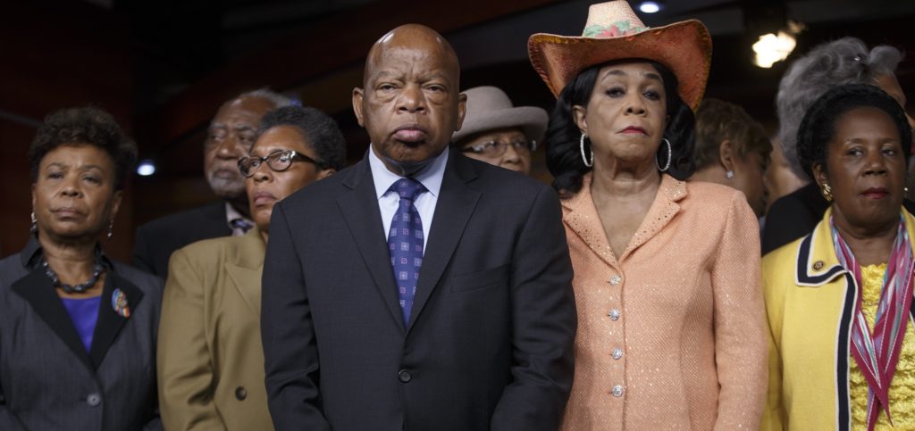 Civil right leader Rep. John Lewis, D-Ga., center, and other members of the Congressional Black Caucus gather to condemn the slayings of police officers in Dallas last night, and to denounce the fatal police shootings of black men in Louisiana and Minnesota earlier in the week, during a news conference, Friday, July 8, 2016, on Capitol Hill in Washington. From left are: Rep. Barbara Lee, D-Calif., Rep. Danny K. Davis, D-Ill., Rep. Marcia L. Fudge, D-Ohio, Rep. John Lewis, D-Ga., Rep. Alma Adams, D-N.C., Rep. Frederica Wilson, D-Fla., and Rep. Sheila Jackson Lee, D-Texas. (AP Photo/J. Scott Applewhite)