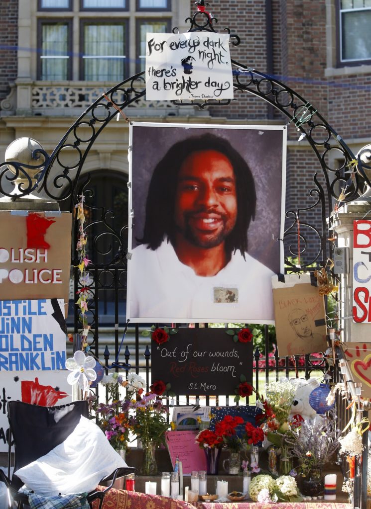 FILE - In this July 25, 2016, file photo, a memorial including a photo of Philando Castile adorns the gate to the governor's residence where protesters continue to demonstrate in St. Paul, Minn., against the July 6, 2016, shooting death of Castile by St. Anthony police Officer Jeronimo Yanez during a traffic stop in Falcon Heights, Minn. Yanez is expected to enter his plea on manslaughter charges during a hearing Monday, Feb. 27, 2017. (AP Photo/Jim Mone, File)