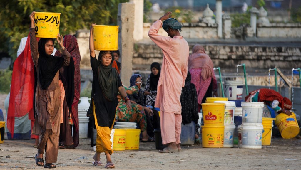 In this Tuesday, Aug. 22, 2017 photo, people collect water for their families from a tube well, in Islamabad, Pakistan, Wednesday, Aug. 23, 2017. A new study suggests some 50 million Pakistanis could be at risk of drinking arsenic-tainted groundwater. The findings are based on a hazard map built using water quality data from 1,200 tube wells in the densely populated Indus Valley. (AP Photo/B.K. Bangash)