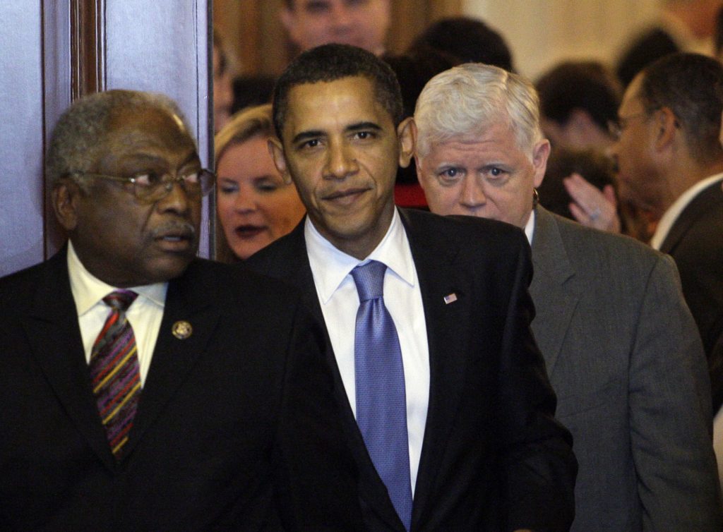 President Barack Obama walks out of the Cannon Caucus Room with Majority Whip James Clyburn, D-S.C., left, after meeting with House democrats about health care on Capitol Hill in Washington, Saturday, Nov. 7, 2009.(AP Photo/Alex Brandon)