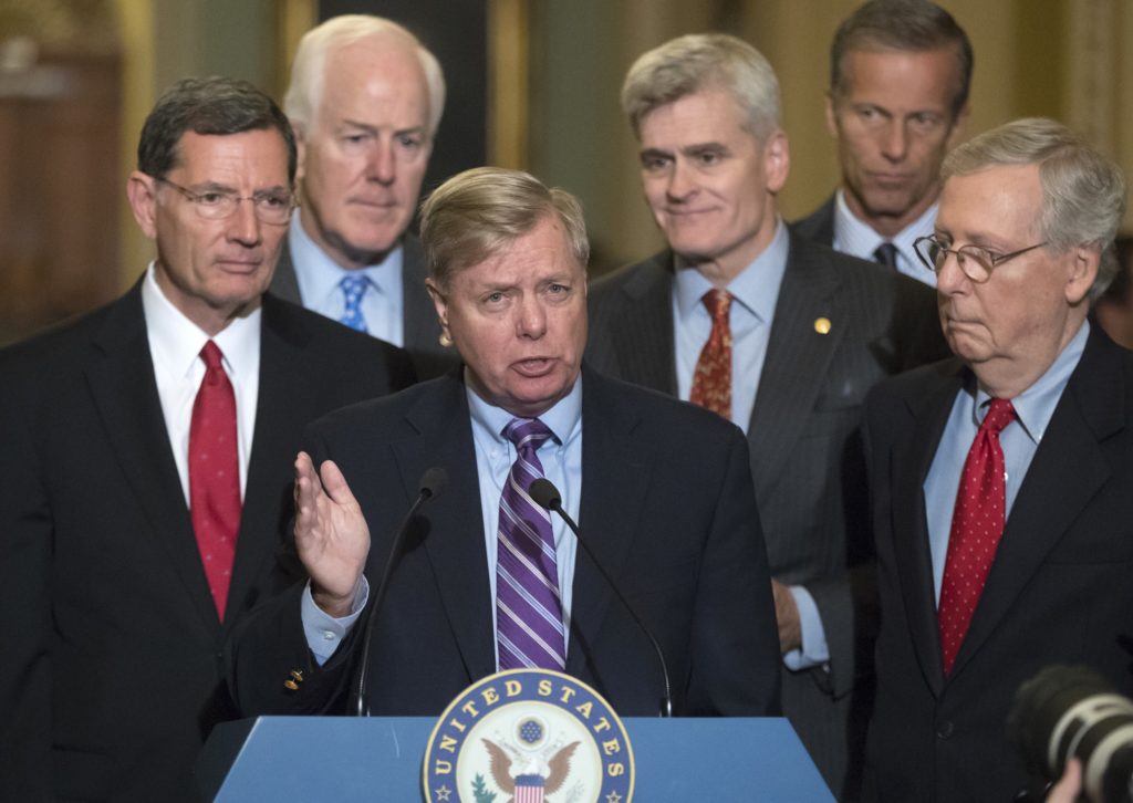 Sen. Lindsey Graham, R-S.C., joined by, from left, Sen. John Barrasso, R-Wyo., Majority Whip John Cornyn, R-Texas, Sen. Bill Cassidy, R-La., Sen. John Thune, R-S.D., and Senate Majority Leader Mitch McConnell, R-Ky., speaks to reporters as he pushes a last-ditch effort to uproot former President Barack Obama's health care law, at the Capitol in Washington, Tuesday, Sept. 19, 2017. (AP Photo/J. Scott Applewhite)