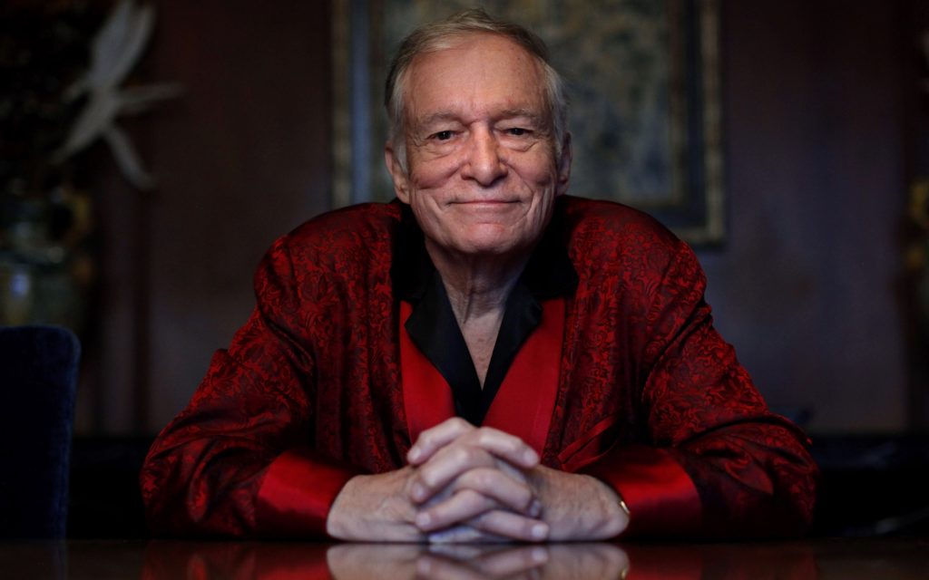 FILE - In this Nov. 4, 2010, file photo, Playboy magazine founder Hugh Hefner poses for photos at the Playboy Mansion in Los Angeles. The Playboy Mansion is up for sale but longtime resident Hefner wants to stay put. Playboy Enterprise announced the West Los Angeles estate, the backdrop of many film shoots and wild parties, was listed on Monday, Jan. 11, 2016, for $200 million. (AP Photo/Jae C. Hong, File)