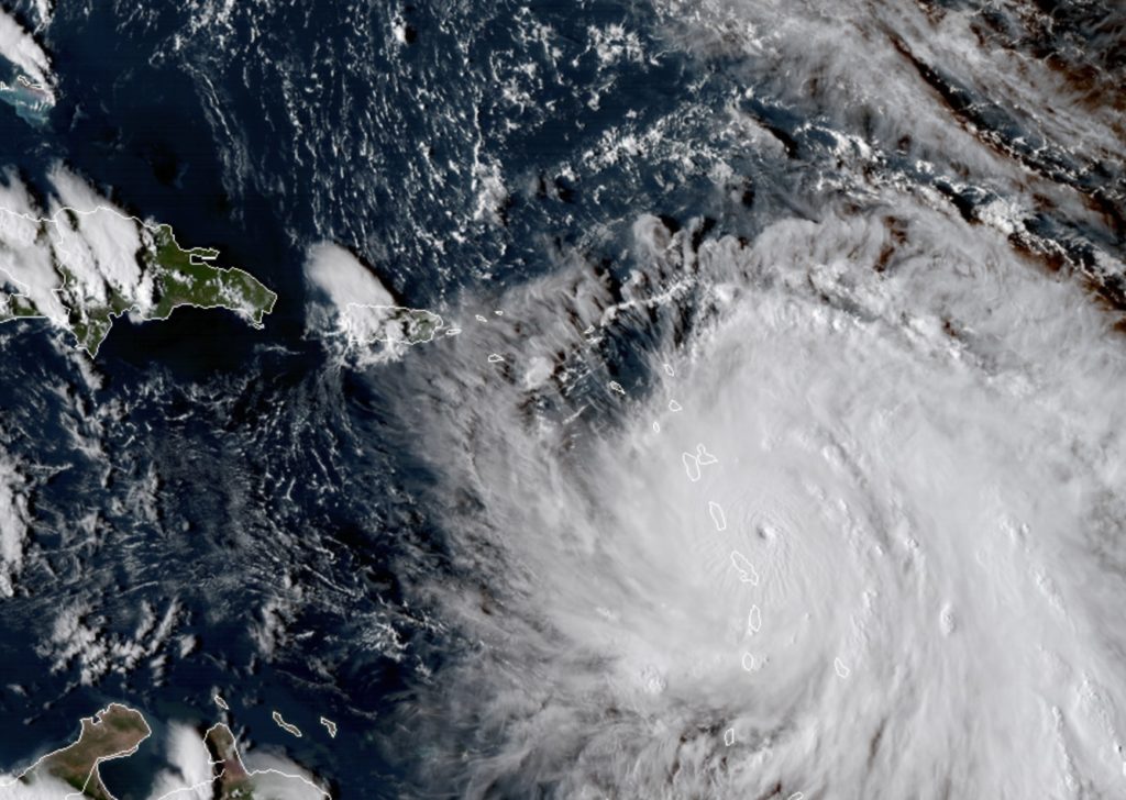 This Monday, Sept. 18, 2017, GOES East satellite image provided by NASA taken at 20:30 UTC, shows the eye of Hurricane Maria as it nears Dominica. The National Hurricane Center in Miami said Monday evening that Air Force Reserve hurricane hunter planes found that Maria had strengthened into a storm with 160 mph (260 kph) winds. (NASA via AP)