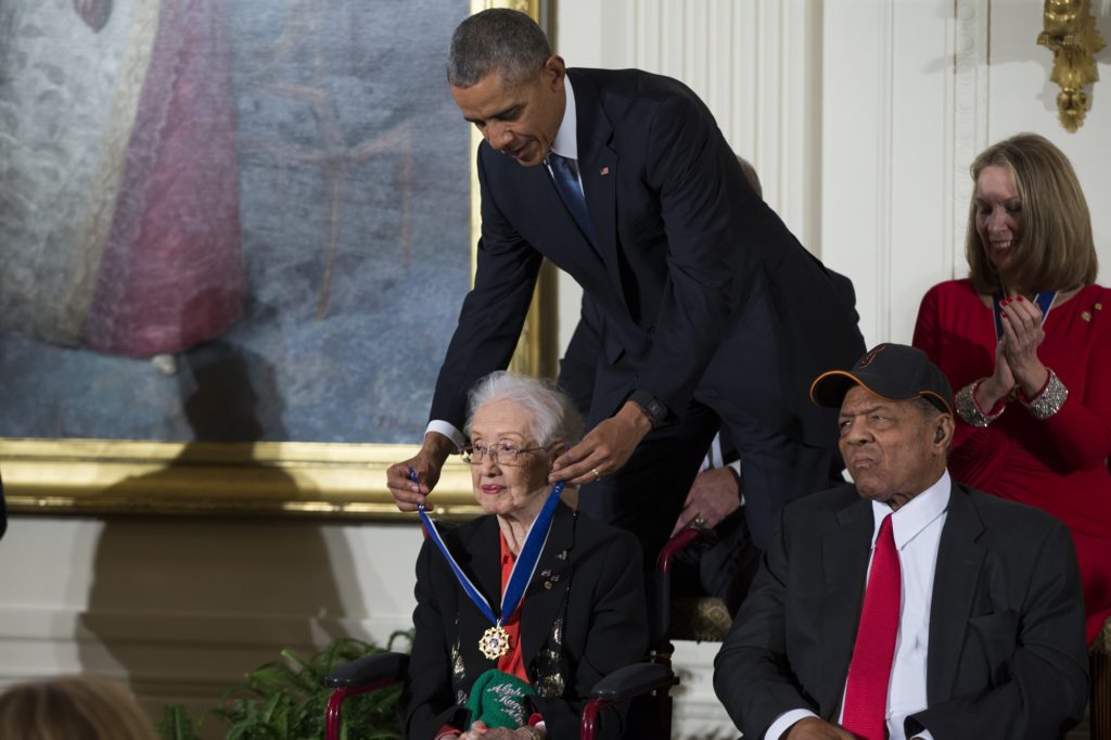 Willie Mays, right, looks on as President Barack Obama presents the Presidential Medal of Freedom to NASA mathematician Katherine Johnson during a ceremony in the East Room of the White House, on Tuesday, Nov. 24, 2015, in Washington. Obama is recognizing 17 people with the nations highest civilian award, including one of the greatest catchers in baseball history and a Funny Girl. (AP Photo/Evan Vucci)