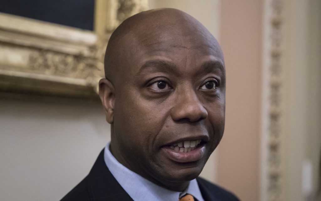Sen. Tim Scott, R-S.C., the only African-American Republican serving in the Senate, talks to reporters about his plan to meet with President Donald Trump to discuss race and Trump's widely criticized response to last month's protests and racial violence in Charlottesville, Va., at the Capitol in Washington, Wednesday, Sept. 13, 2017. (AP Photo/J. Scott Applewhite)