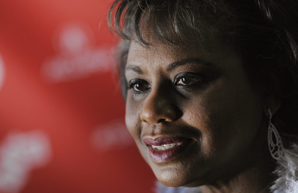 FILE- In Jan. 19, 2013 file photo, Anita Hill, subject of the documentary film "ANITA," poses at the premiere of the film at the 2013 Sundance Film Festival, in Park City, Utah. From the Clarence Thomas hearings to the Harvey Weinstein scandal: Some 26 years after her testimony brought sexual harassment into the national spotlight, Hill says she sees the needle moving yet again with the saga that is transfixing Hollywood. Yet Hill also cautions that real-world progress will be incremental at best, and many women in the workplace still fear retaliation if they come forward. Others cite confidential settlements as a hindrance to progress. (Photo by Chris Pizzello/Invision/AP, File)