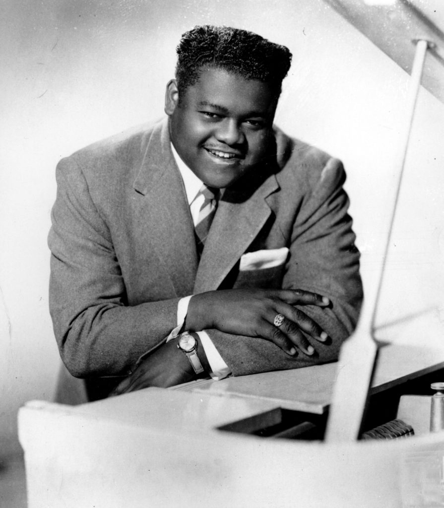 This is a 1956 photograph of singer, composer and pianist Fats Domino. He popularized rock and roll in the 1950s and early 1960s with his songs that include "Blueberry Hill," "Ain't That a Shame," and "Blue Monday." (AP Photo)