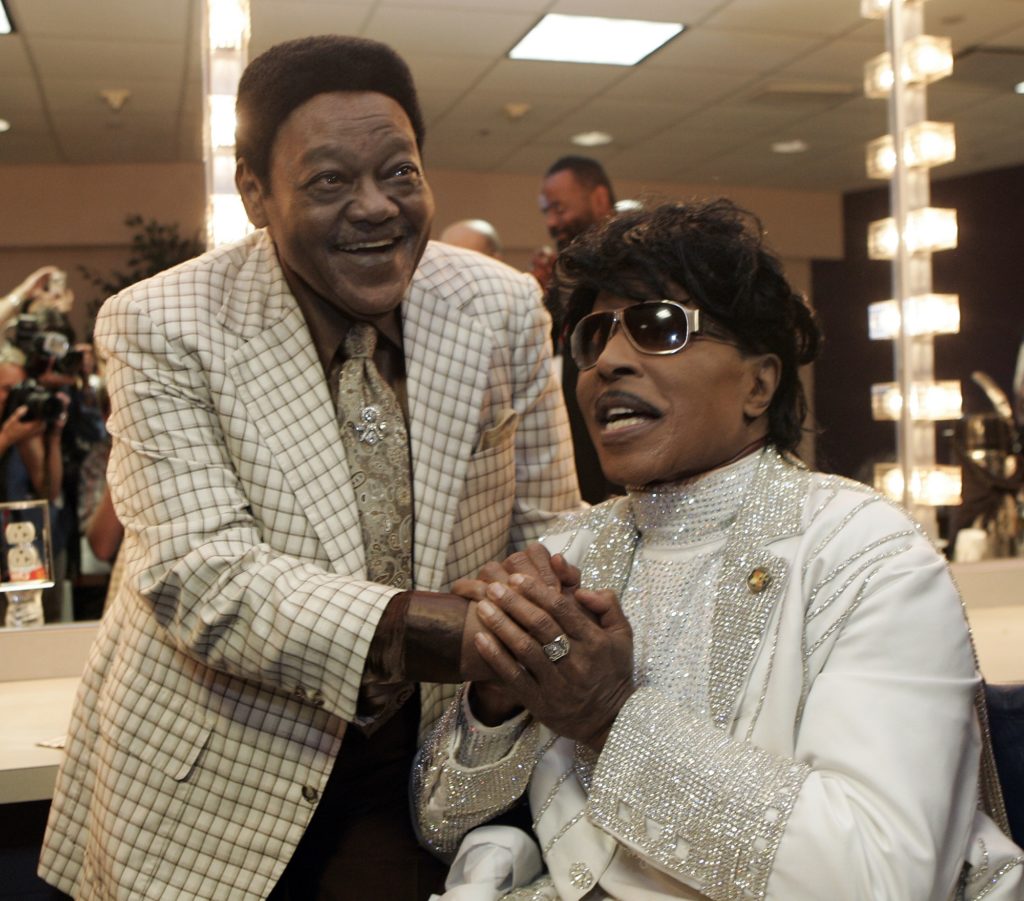 Fats Domino visits with Little Richard in a dressing room after Richards' performance at The Domino Effect, a tribute concert for Domino, at the New Orleans Arena in New Orleans, Saturday, May 30, 2009. A portion of the proceeds from the concert will go to New Orleans Saints quarterback Drew Brees' charitable foundation, the Brees Dream Foundation, which aims to improve local playgrounds and recreation sites in New Orleans. (AP Photo/Patrick Semansky)