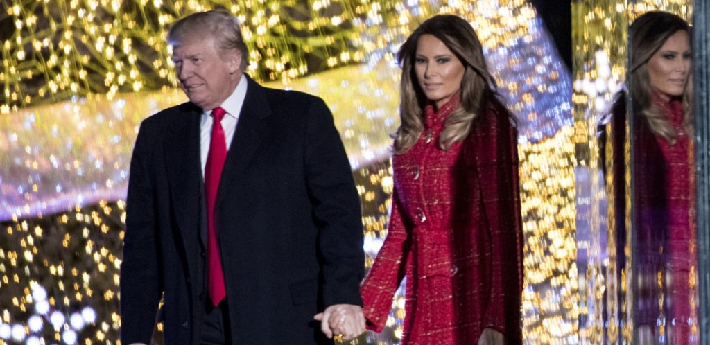 President Donald Trump and first lady Melania Trump stand on stage after lighting the 2017 National Christmas Tree on the Ellipse near the White House, Thursday, Nov. 30, 2017, in Washington. (AP Photo/Andrew Harnik)