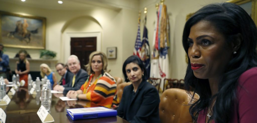 Dr. Douglas Lake, from Iowa, left, Health and Human Services Secretary Tom Price, Candace Fowler, from Missouri, and Seema Verma, Administrator of the Centers for Medicare and Medicaid Services, listen as Omarosa Manigault, Office of Public Lieason, speaks in the Roosevelt Room of the White House, Wednesday, June 21, 2017, in Washington. Senate Republicans are steering toward a potential showdown vote on their long-awaited health care bill, despite indications that they've yet to solidify the 50 GOP votes they'll need to avert an embarrassing defeat. A draft of the still-secret bill is expected to be unveiled Thursday. (AP Photo/Alex Brandon)