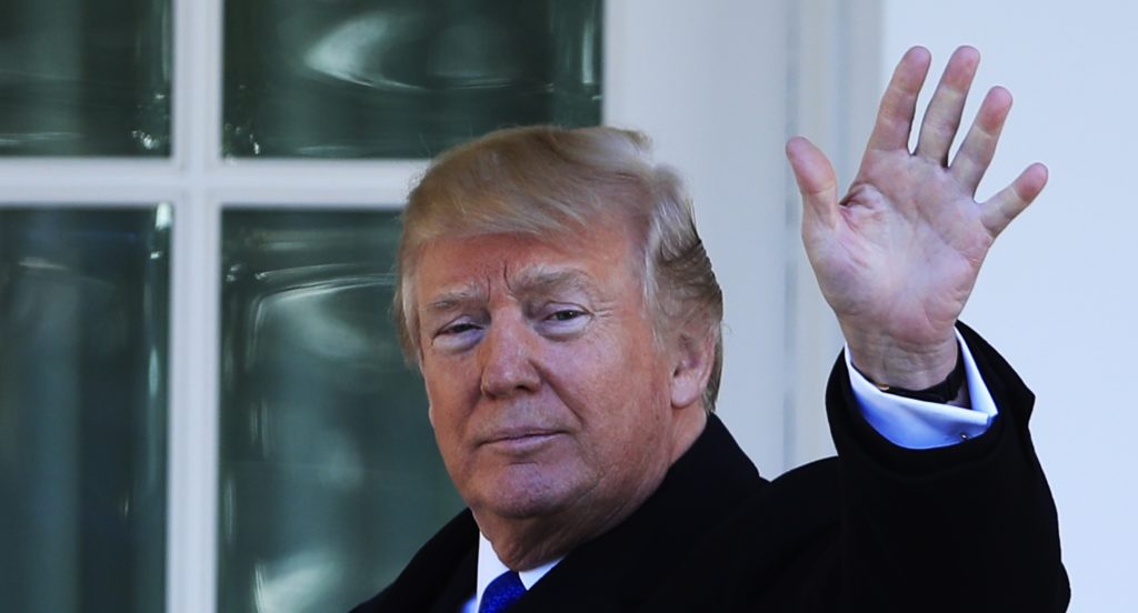 President Donald Trump waves to anti-abortion supporters and participants of the annual March for Life event, from the Colonnade outside the Oval Office of the White House in Washington, Friday, Jan. 19, 2018. (AP Photo/Manuel Balce Ceneta)