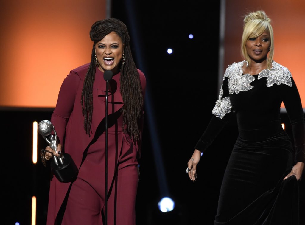 Ava DuVernay, left, accepts the award for the entertainer of the year as Mary J. Blige looks on at the 49th annual NAACP Image Awards at the Pasadena Civic Auditorium on Monday, Jan. 15, 2018, in Pasadena, Calif. (Photo by Chris Pizzello/Invision/AP)