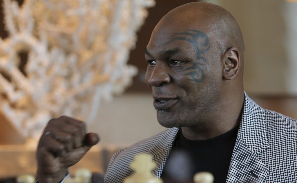 Mike Tyson makes a fist during an interview with The Associated Press, in Dubai, United Arab Emirates, Thursday, May 4, 2017. Tyson is in Dubai to announce the start of his worldwide boxing gym franchise. Tyson said Thursday that a city like Dubai can show people the best of the Middle East, its people and Islam. Tyson praised the sheikhdom as "a party place, a place you have a good time at. This is like New York, man!" He said that contradicts some negative perceptions of the Mideast. (AP Photo/Kamran Jebreili)