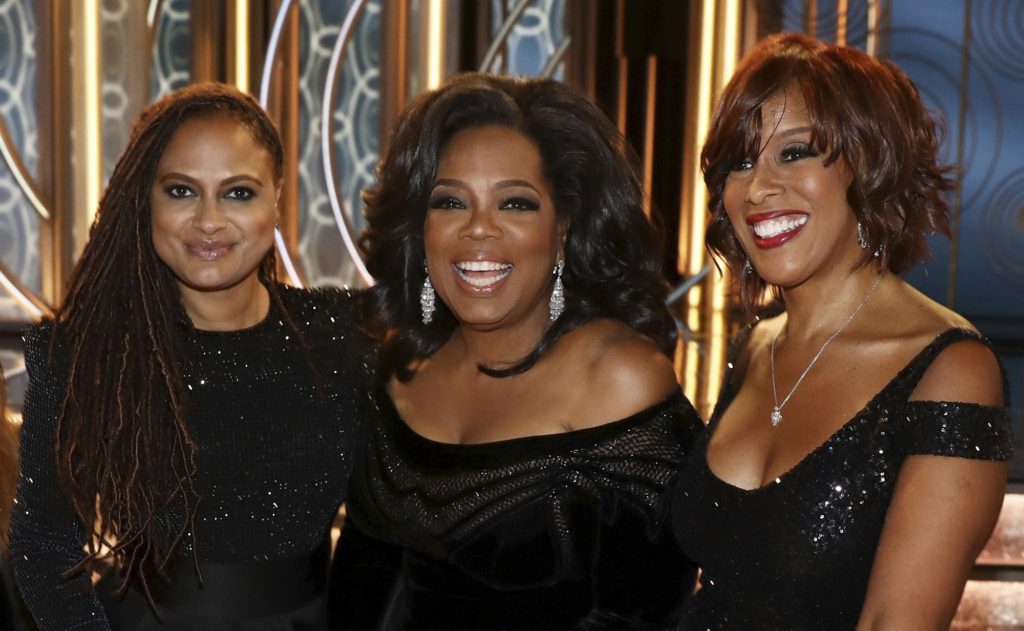 IMAGE DISTRIBUTED FOR LINDT CHOCOLATE - Ava DuVernay, left, Oprah Winfrey, center, and Gayle King are seen at the Golden Globes sponsored by Lindt Chocolate on Sunday, Jan. 7, 2018 in Beverly Hills, Calif. (Photo by Matt Sayles/Invision for Lindt Chocolate/AP Images)