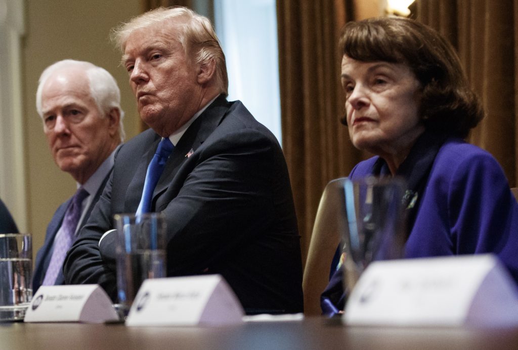 From far left, Rep. Marsha Blackburn, R-Tenn., Sen. John Cornyn, R-Texas, President Donald Trump and Sen. Dianne Feinstein, D-Calif., look across the table in the Cabinet Room of the White House, in Washington, Wednesday, Feb. 28, 2018, during a meeting with members of congress to discuss school and community safety. (AP Photo/Carolyn Kaster)