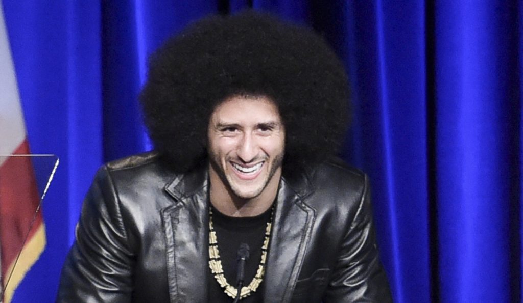 FILE - In this Dec. 3, 2017, file photo, Colin Kaepernick attends the 2017 ACLU SoCal's Bill of Rights Dinner at the Beverly Wilshire Hotel in Beverly Hills, Calif. A visit by former San Francisco 49ers quarterback Colin Kaepernick to New York's Rikers Island jail facility has drawn a rebuke from the union representing city correction officers. The head of the Correction Officers Benevolent Association tells the Daily News that Kaepernick's presence at Rikers on Tuesday, Dec. 12, 2017, will encourage inmates to attack jail guards. (Photo by Richard Shotwell/Invision/AP, File)