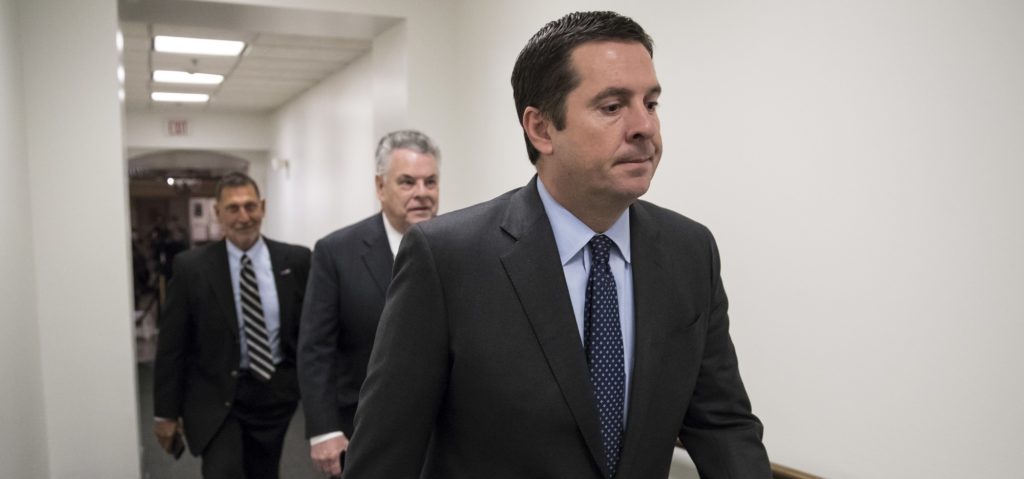 House Intelligence Committee Chairman Devin Nunes, R-Calif., a close ally of President Donald Trump who has become a fierce critic of the FBI and the Justice Department, strides to a GOP conference followed by Rep. Peter King, R-N.Y., also a member of the Intelligence Committee, at the Capitol in Washington, Tuesday, Feb. 6, 2018. Trump last week declassified a document written by the committee's Republican majority that criticized methods the FBI used to obtain a surveillance warrant on a onetime Trump campaign associate. Trump said the GOP memo showed the FBI and Justice Department conspired against him in the Russia probe. (AP Photo/J. Scott Applewhite)