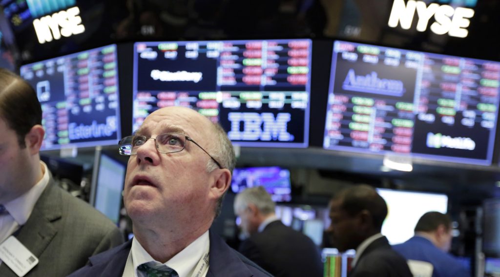 Trader Frederick Reimer works on the floor of the New York Stock Exchange, Tuesday, Feb. 6, 2018. The Dow Jones industrial average fell as much as 500 points in early trading, bringing the index down 10 percent from the record high it reached on Jan. 26. The DJIA quickly recovered much of that loss. (AP Photo/Richard Drew)