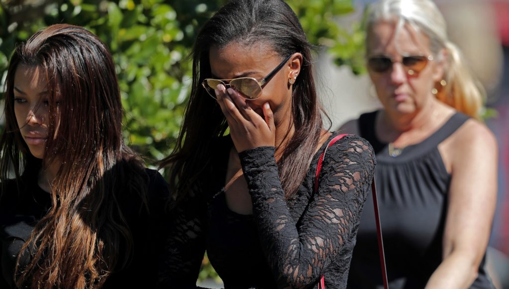 Mourners leave the funeral of Meadow Pollack, a victim of the Wednesday shooting at Marjory Stoneman Douglas High School, in Parkland, Fla., Friday, Feb. 16, 2018. Nikolas Cruz, a former student, was charged with several counts of premeditated murder on Thursday. (AP Photo/Gerald Herbert)