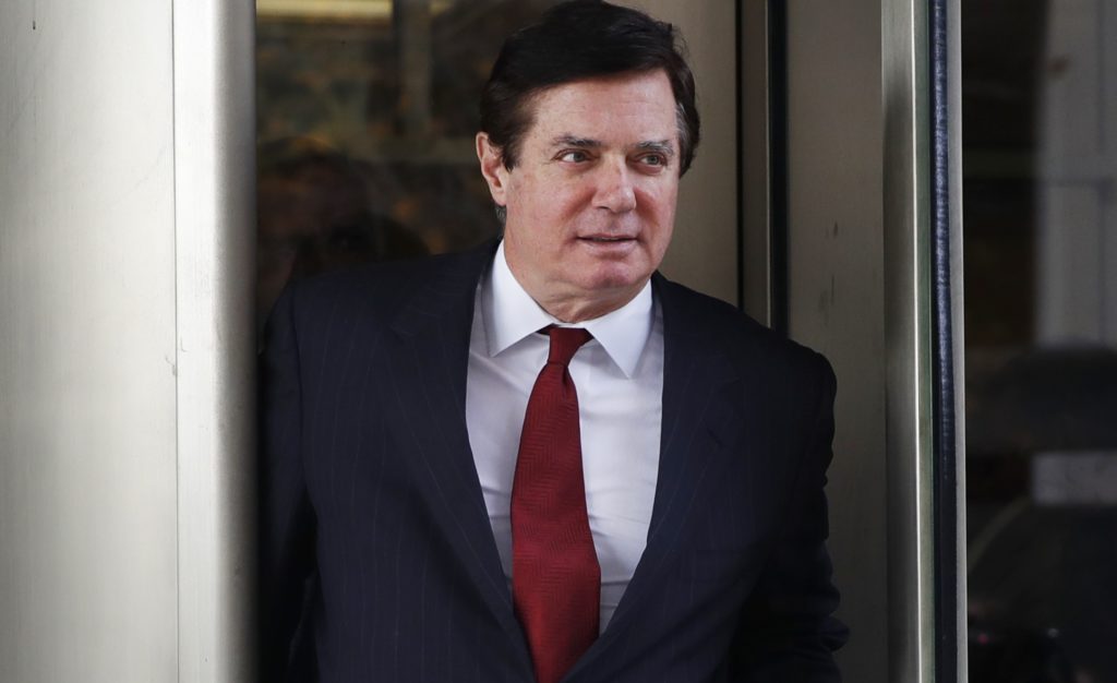 In this Nov. 6, 2017 photo, Paul Manafort, President Donald Trump's former campaign chairman, leaves the federal courthouse in Washington.   Court records indicate at least one new charge has been filed under seal in the case against President Donald Trump's former campaign chairman. The filing indicates a sealed charging document was entered in Paul Manafort's case. No details such as who it’s against or whether it’s part of a plea deal are disclosed.  (AP Photo/Jacquelyn Martin)