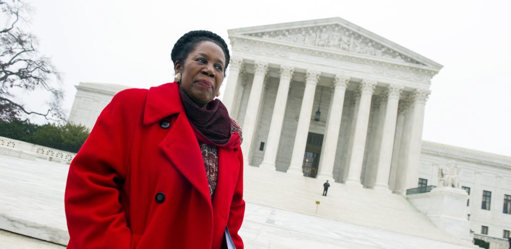 Rep. Sheila Jackson Lee, D-Texas waits to speak outside the Supreme Court in Washington, Wednesday, Dec. 9, 2015, after the court heard oral arguments in the Fisher v. University of Texas at Austin affirmative action case. (AP Photo/Cliff Owen)