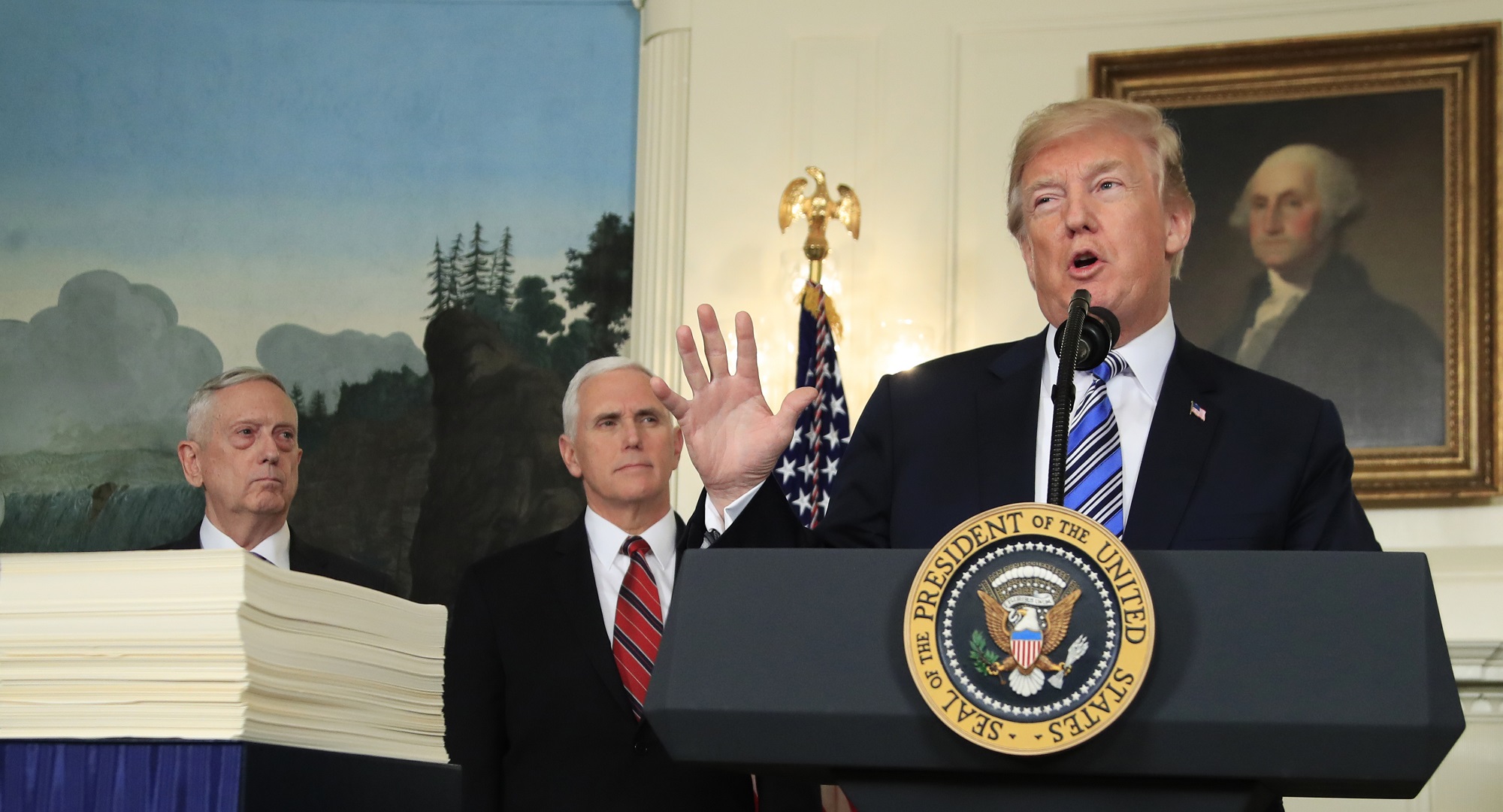 President Donald Trump with, Defense Secretary Jim Mattis, left, and Vice President Mike Pence, speaks in the Diplomatic Room of the White House in Washington, Friday, March 23, 2018, about the $1.3 trillion spending bill. (AP Photo/Manuel Balce Ceneta)