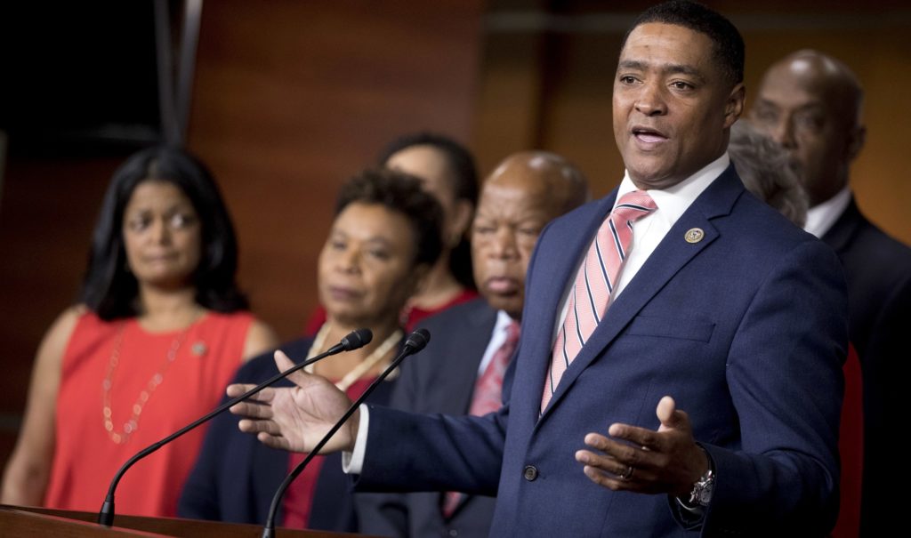 Congressional Black Caucus Chairman Rep. Cedric Richmond, D-La., right, speaks at a Congressional Tri-Caucus news conference on Capitol Hill in Washington, Wednesday, Sept. 27, 2017, on injustice and inequality in America. The Congressional Tri-Caucus is comprised of the Congressional Black Caucus, Congressional Hispanic Caucus and the Congressional Asian Pacific American Caucus. Also pictured from lef are, Rep. Pramila Jayapal, D-Wash., Rep. Sheila Jackson Lee, D-Texas, and Rep. John Lewis, D-Ga. (AP Photo/Andrew Harnik)