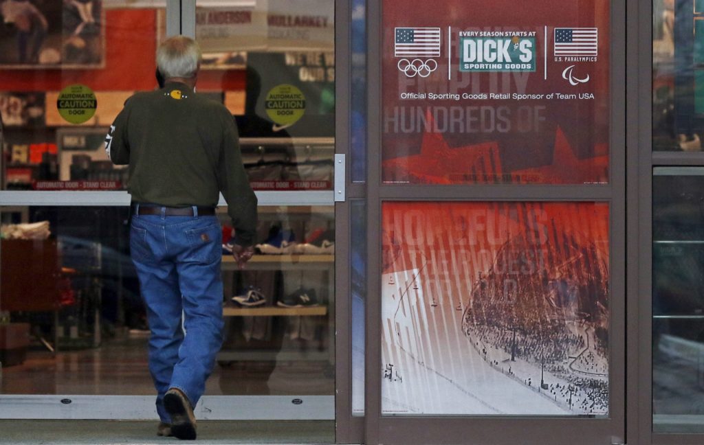 A customer enters a Dick's Sporting Goods store in Madison, Miss., Thursday, March 1, 2018. Dick's Sporting Goods and Walmart took steps Wednesday to restrict gun sales, adding two retail heavyweights to the growing rift between corporate America and the gun lobby. (AP Photo/Rogelio V. Solis)