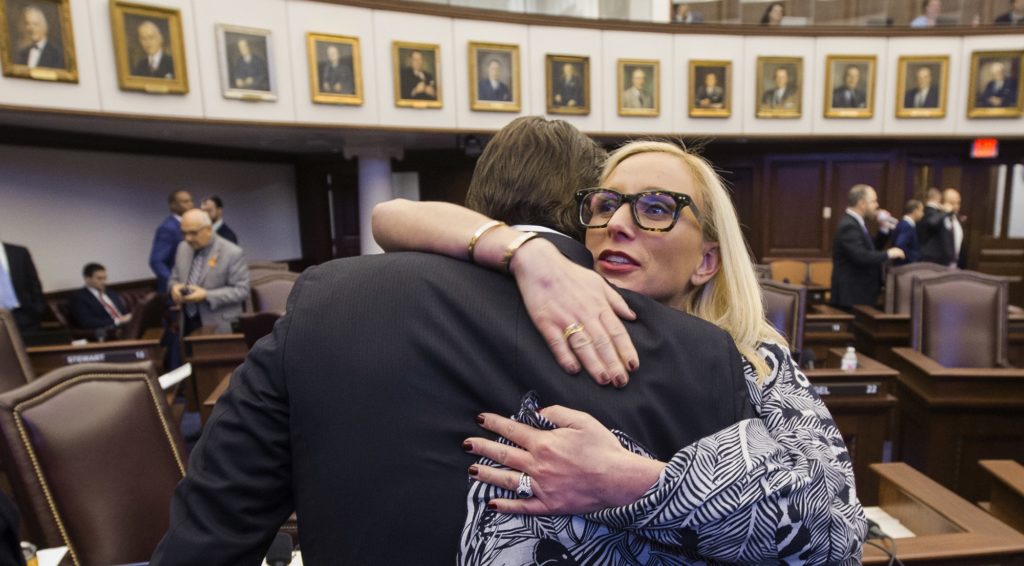 Florida Sen. Lauren Book, right, embraces Sen. Bill Galvano after Galvano's bill, the Marjory Stoneman Douglas High School Student Safety Act, passed 20-18 at the Florida Capitol in Tallahassee, Fla., Monday, March 5, 2018. (AP Photo/Mark Wallheiser)