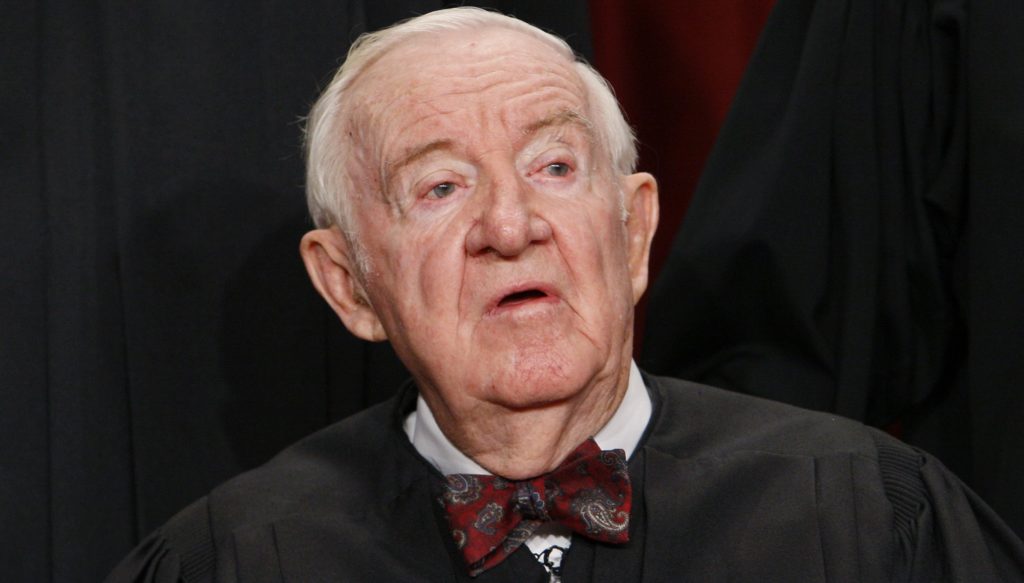 FILE - In this Sept. 29, 2009, file photo Associate Justice John Paul Stevens sits for a new group photograph at the Supreme Court in Washington. Stevens, the oldest justice who turns 90 this April 2010, says he'll decide soon about retiring, for his own peace of mind and to give President Barack Obama and the Senate plenty of time to replace him. (AP Photo/Charles Dharapak, File)