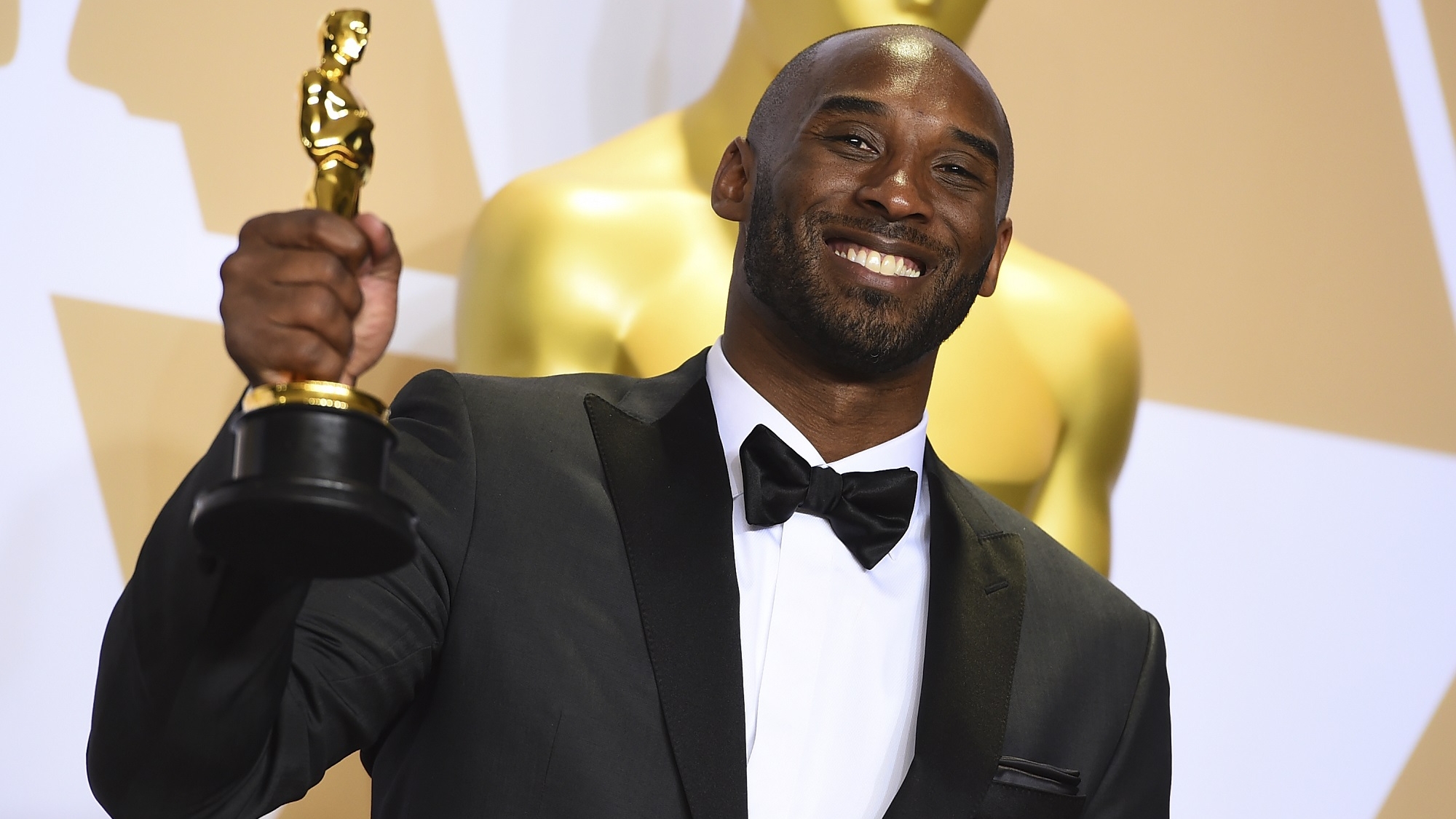 Kobe Bryant, winner of the award for best animated short for "Dear Basketball", poses in the press room at the Oscars on Sunday, March 4, 2018, at the Dolby Theatre in Los Angeles. (Photo by Jordan Strauss/Invision/AP)