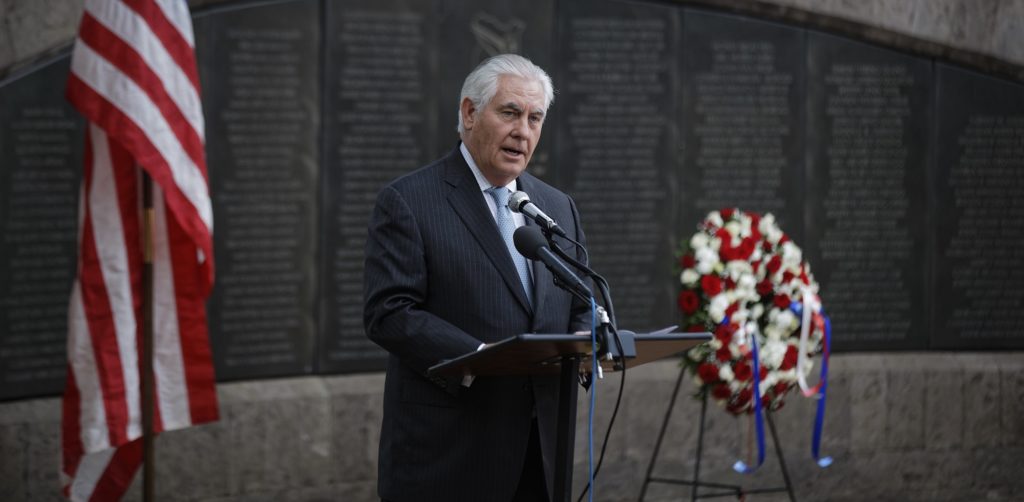 U.S. Secretary of State Rex Tillerson speaks to survivors after laying a wreath during a ceremony at Memorial Park in honor of the victims of the deadly 1998 U.S. Embassy bombing, in Nairobi, Kenya, Sunday, March 11, 2018.  In 1998 the US embassies were bombed in near simultaneous attacks in two East African cities, in which over 200 people were killed. (AP Photo/Ben Curtis)