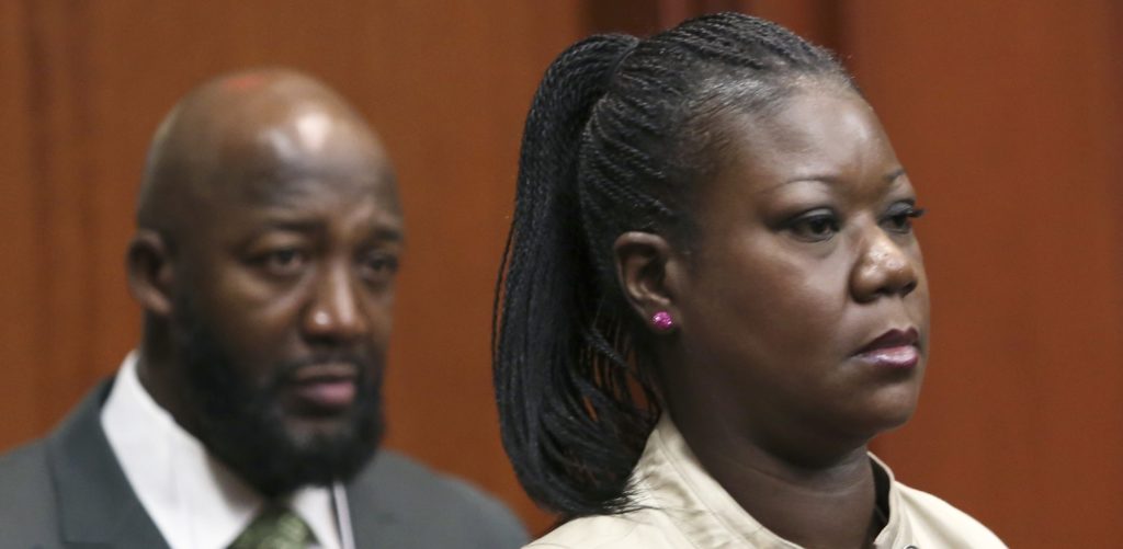Trayvon Martin's parents, Tracy Martin, left, and Sybrina Fulton, enter the courtroom during George Zimmerman's trial in Seminole County circuit court in Sanford, Fla. Tuesday, June 25, 2013. Zimmerman has been charged with second-degree murder for the 2012 shooting death of Trayvon Martin. (AP Photo/Orlando Sentinel, Gary W. Green, Pool)