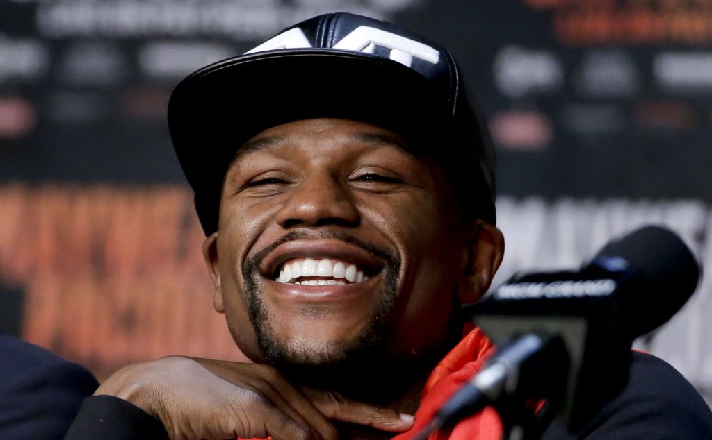 FILE - In this April 29, 2015, file photo, boxer Floyd Mayweather Jr. smiles during a pre-fight news conference in Las Vegas. Mayweather is being inducted into the Southern Nevada Sports Hall of Fame in Las Vegas on Friday, June 2, 2017. (AP Photo/Chris Carlson, File)