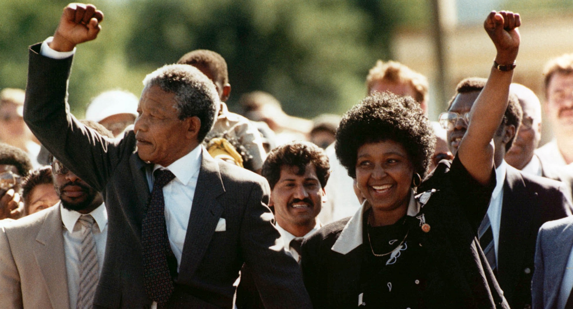 FILE -- In this Sunday, Feb. 11, 1990 file photo, Nelson Mandela and wife Winnie, walk hand-in hand-with their raised clenched fists upon Mandela's release from Victor Verster prison, near Cape Town South Africa. Mandela never met with Martin Luther King Jr but the two fought for the same issues at the same time on two different continents. Mandela said in a 1964 speech that he was prepared to die to see his dream of a society where blacks and whites were equal become reality. King was killed by an assassin's bullet while working for that same dream. ( (AP Photo/Greg English, File)