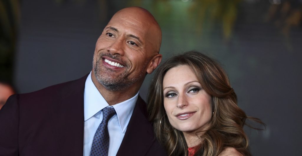 Lauren Hashian and Dwayne Johnson arrives at the Los Angeles premiere of "Jumanji: Welcome to the Jungle" on Monday, Dec. 11, 2017 in Hollywood, Calif. (Photo by Jordan Strauss/Invision/AP)