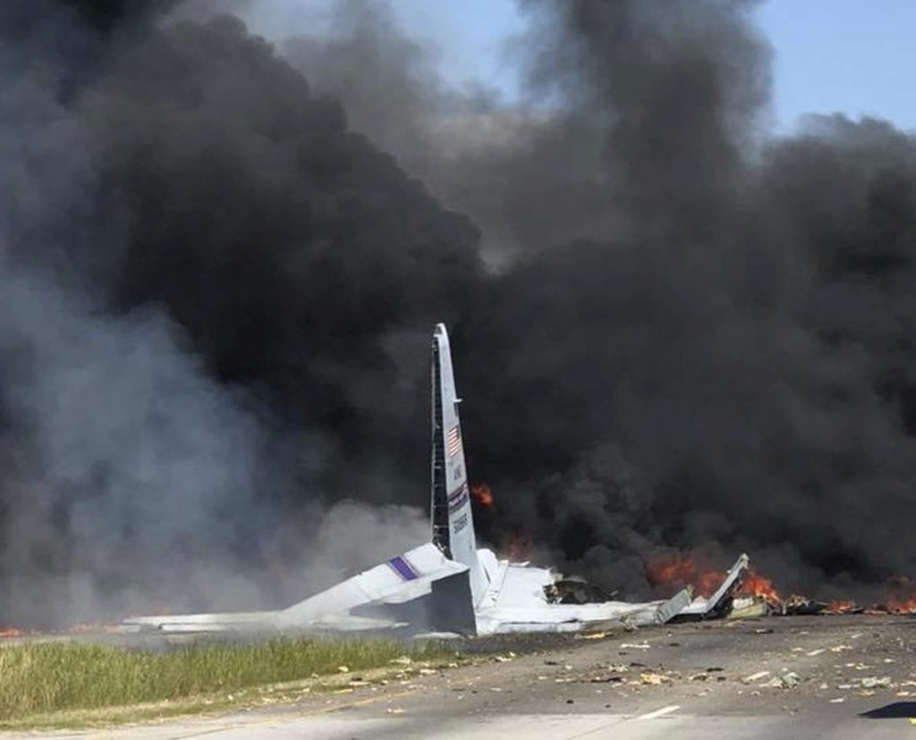 Flames and smoke rise from an Air National Guard C-130 cargo plane after it crashed near Savannah, Ga., Wednesday, May 2, 2018. (James Lavine via AP)