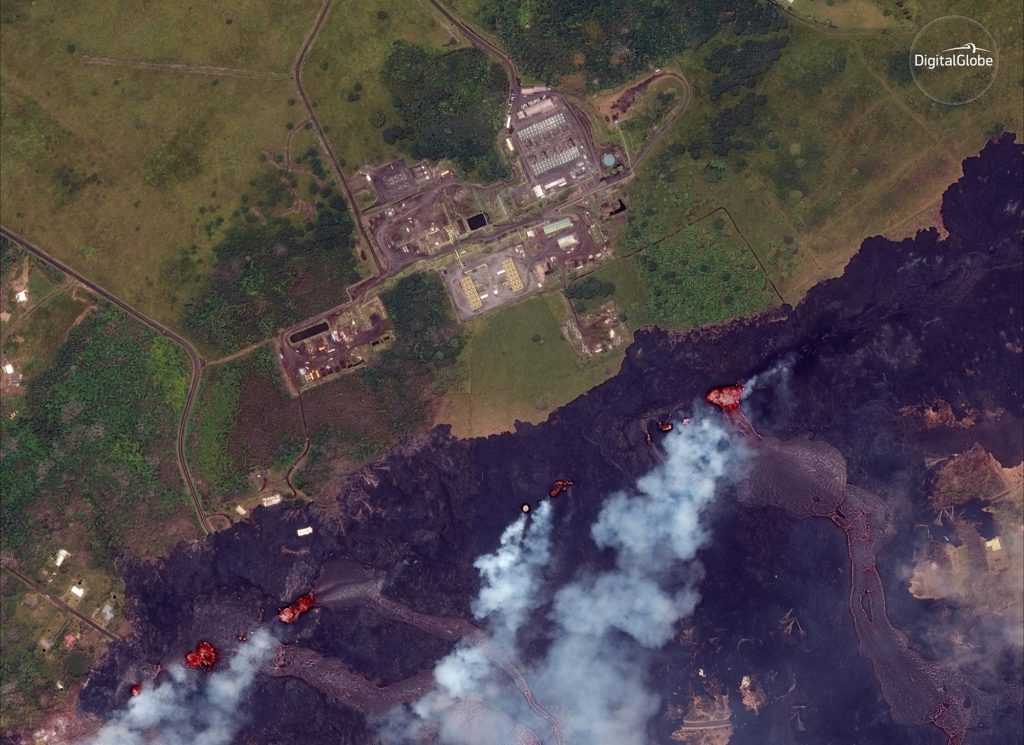This May 23, 2018, Satellite photo provided by DigitalGlobe shows lava coming out of fissures caused by Kilauea volcano, near Puna Geothermal Venture, a geothermal energy plant, in Pahoa, Hawaii. Wendy Stovall, a scientists with the U.S. Geological Stovall said lava spatter from one of the vents was forming a wall that was helping protect the geothermal plant. (Satellite Image ©2018 DigitalGlobe, a Maxar company via AP)